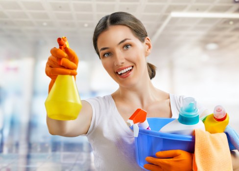 Local domestic cleaning service working in a family home with careful attention to detail