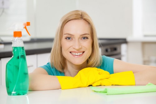 Technician treating carpet stains during a local move-out clean