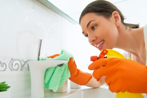 Detailed kitchen cleaning during an end of tenancy clean with attention to surfaces and appliances