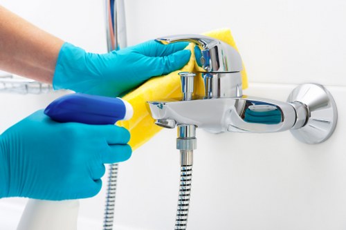 Local technician cleaning a rug in a residential property with careful access