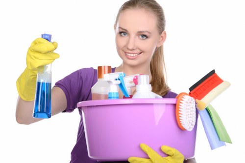 Trained cleaner following safe methods in a London property