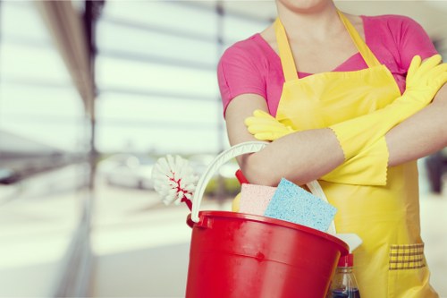 Staff using protective equipment while handling cleaning products safely